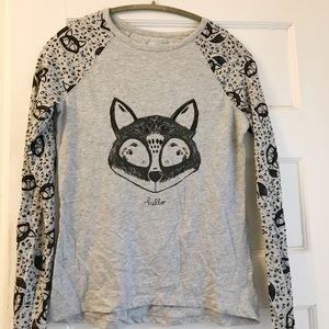 A kid’s long sleeved fox shirt